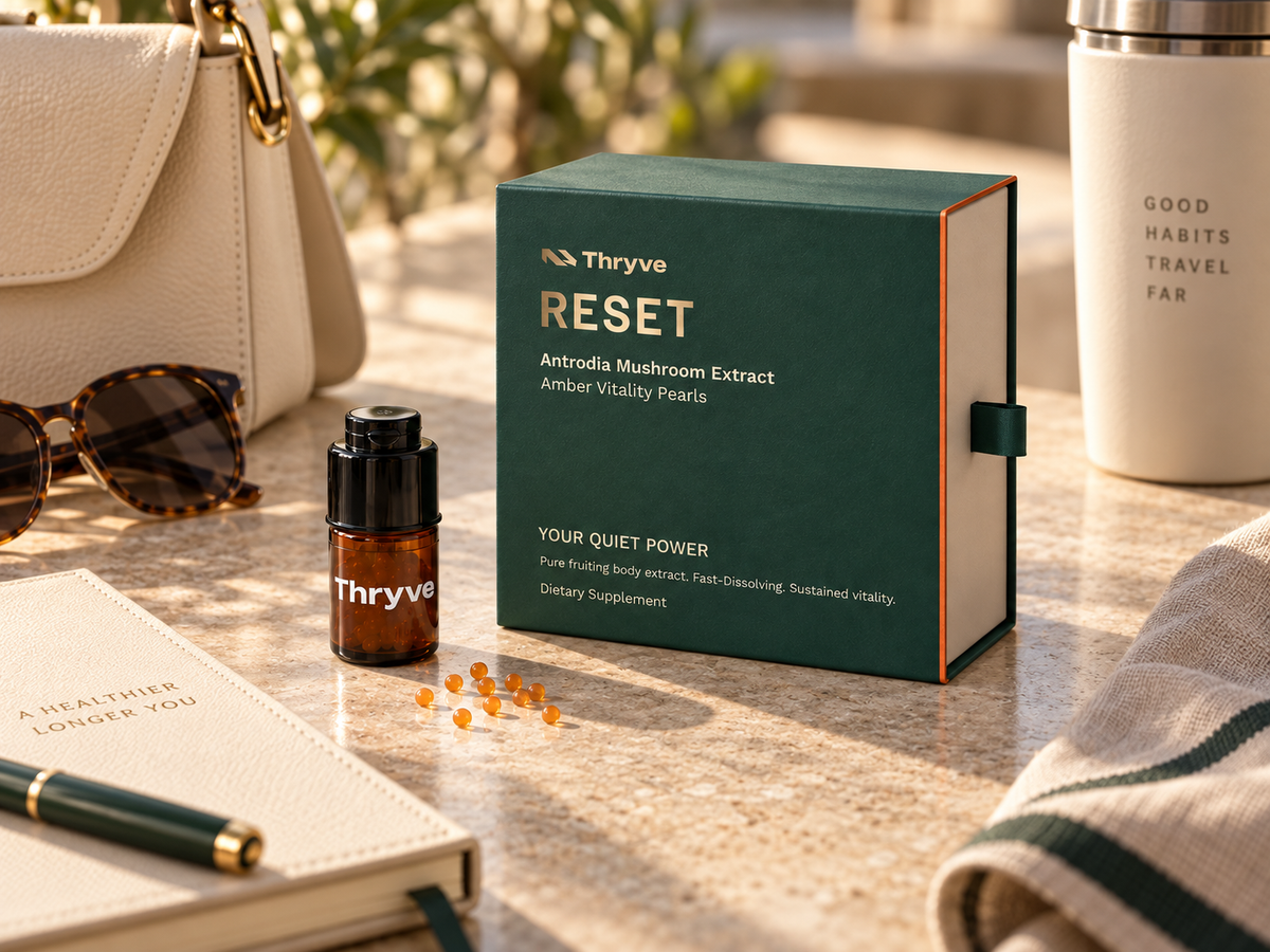 Thryve RESET Amber Vitality Pearls with portable vial in an everyday travel setting